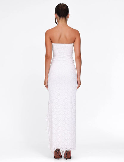 Back view of white lace maxi dress with strapless cut and long train