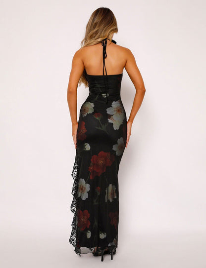 Back view of black strapless maxi dress with white and red floral design