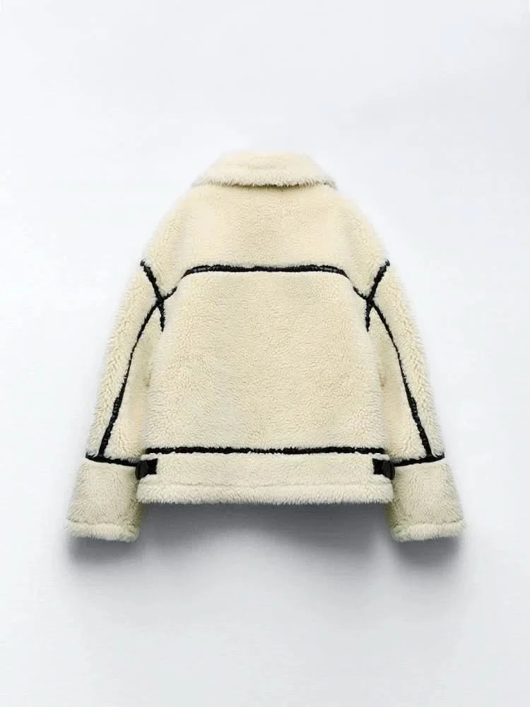 Back flat lay of cream teddy coat with black piping and seam details