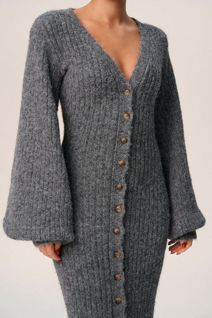 Close-up of gray ribbed knit cardigan V-neck with wooden button closure