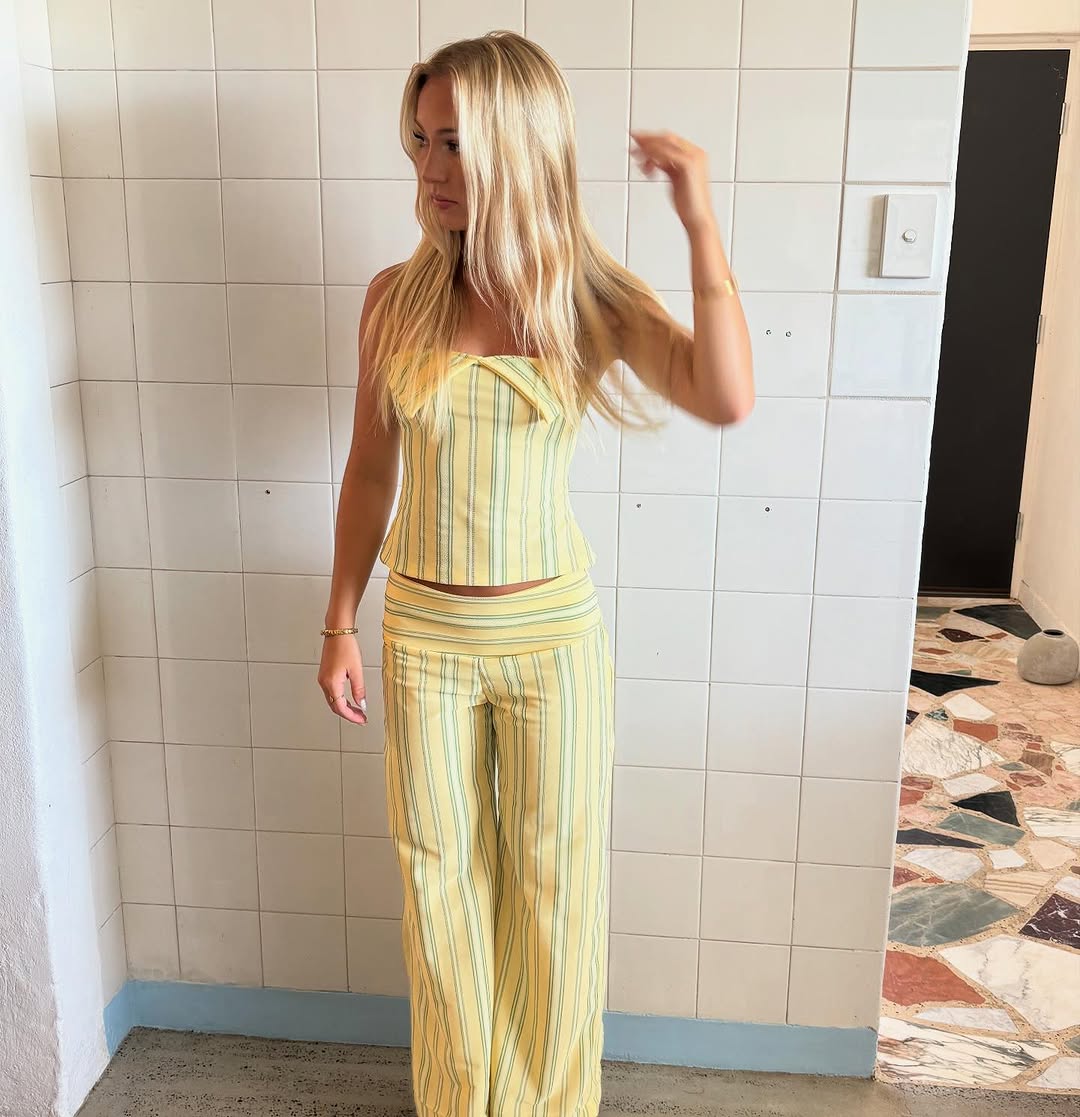 Yellow striped strapless crop top with coordinating striped pants