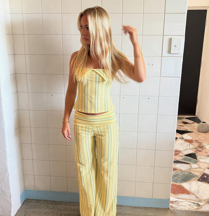 Yellow striped strapless crop top with coordinating striped pants