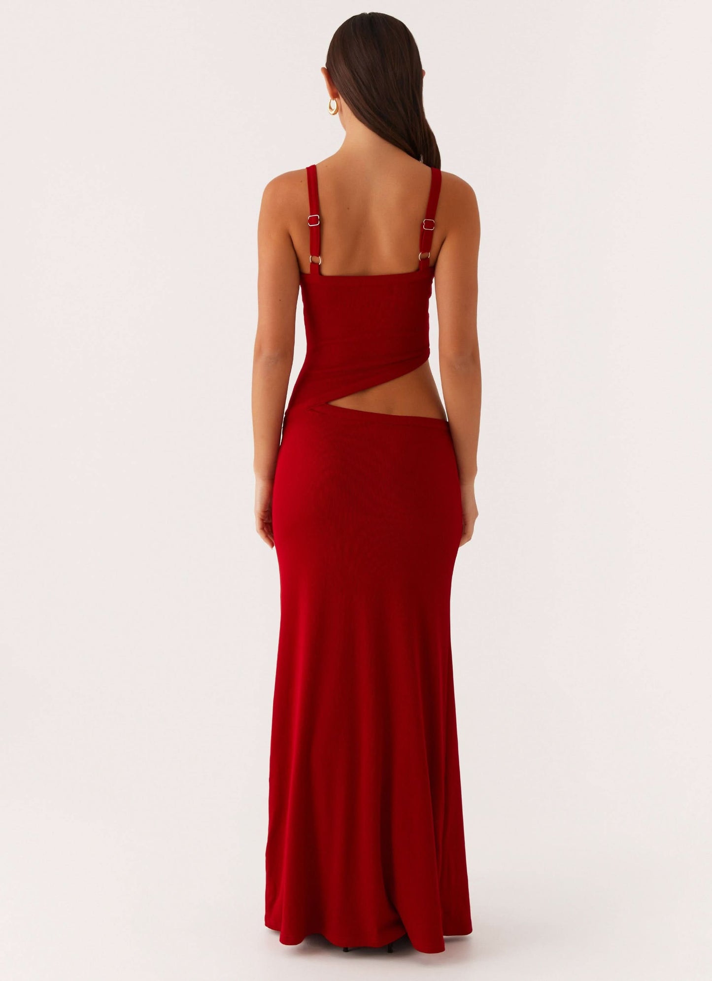 Back view of red maxi dress showing open back with cutout detail