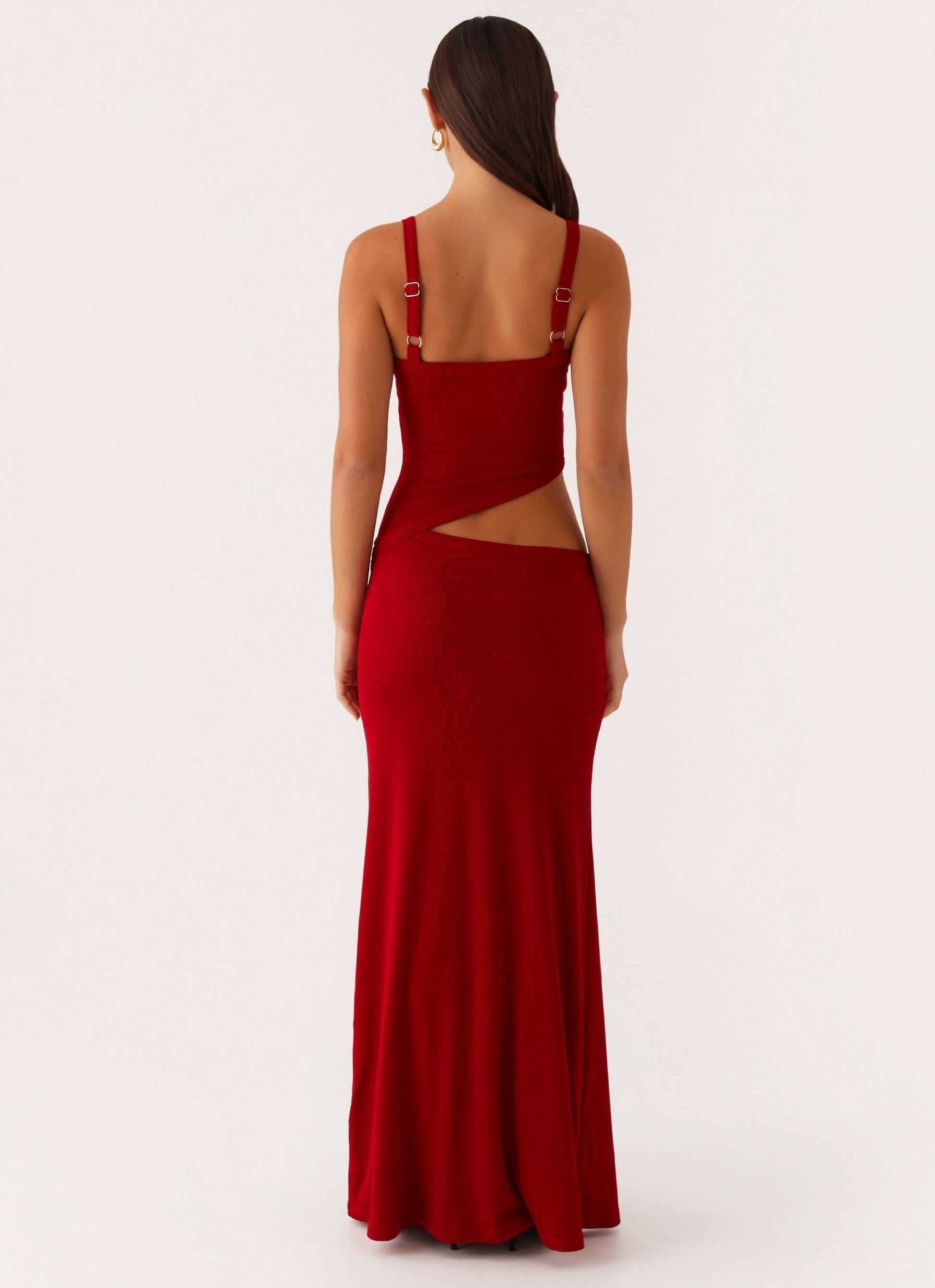 Back view of red maxi dress showing open back with cutout detail