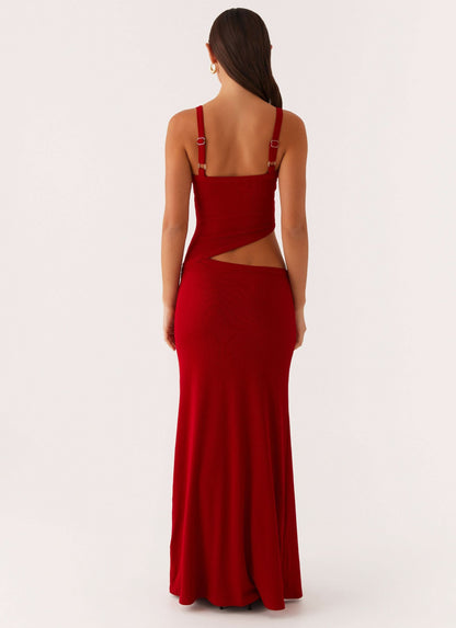 Back view of red maxi dress showing open back with cutout detail