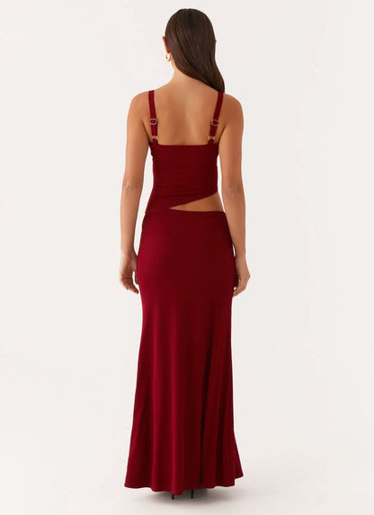 Rear angle of red maxi dress with waist cutout and adjustable straps