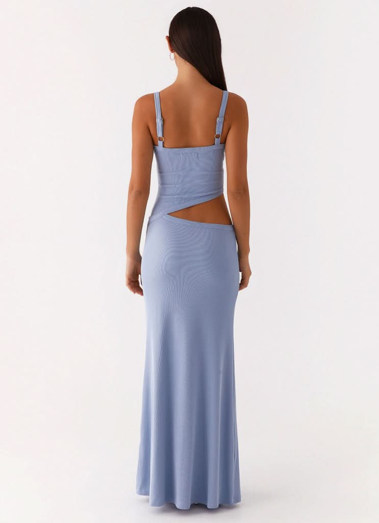 Back view of periwinkle blue maxi dress with open back cutout detail