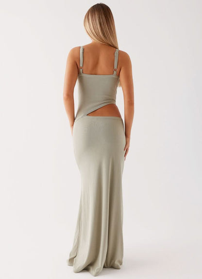 Back view of sage green maxi dress with open back and strappy design