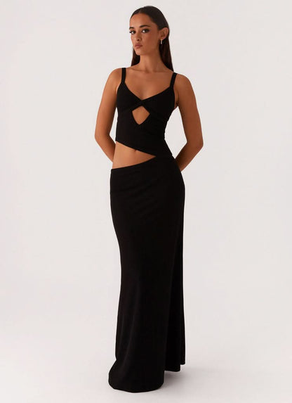 Black velvet maxi dress with heart-shaped cutout and straps