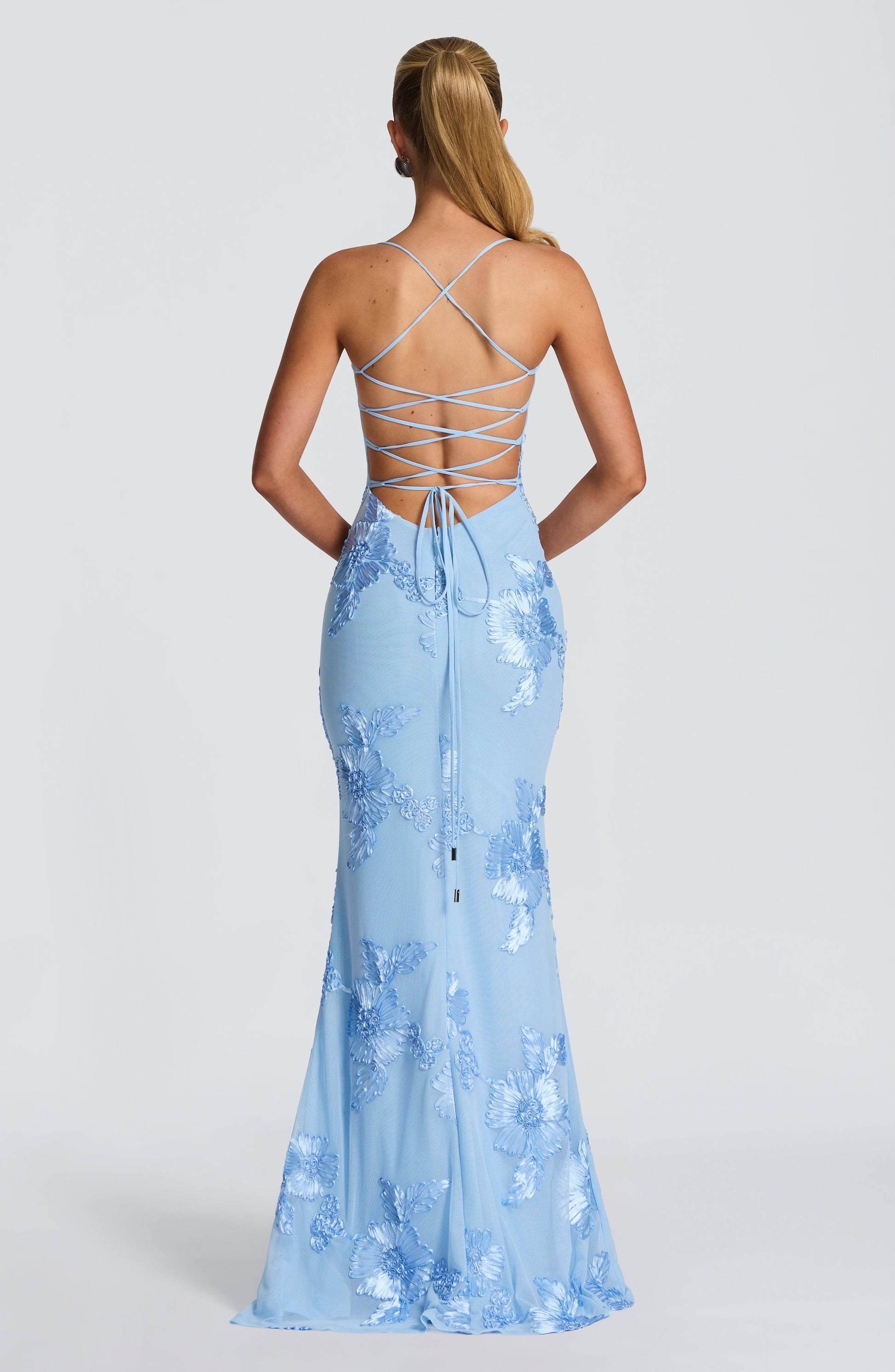 Back view of light blue floral maxi dress with lace-up corset back detail