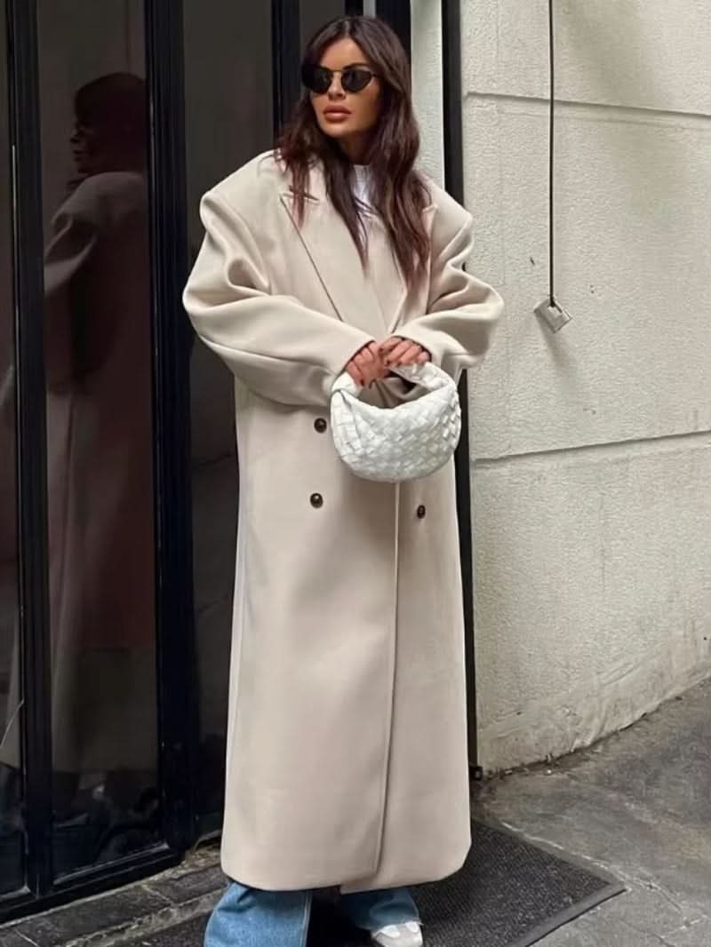 Cream long coat with double-button closure and straight silhouette
