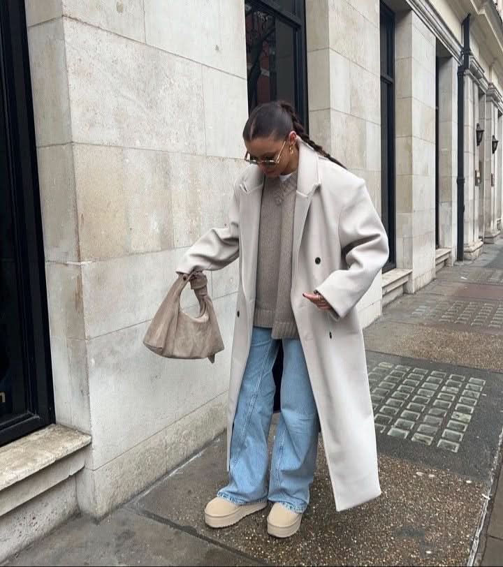 Cream wool long coat with single-button closure worn with jeans