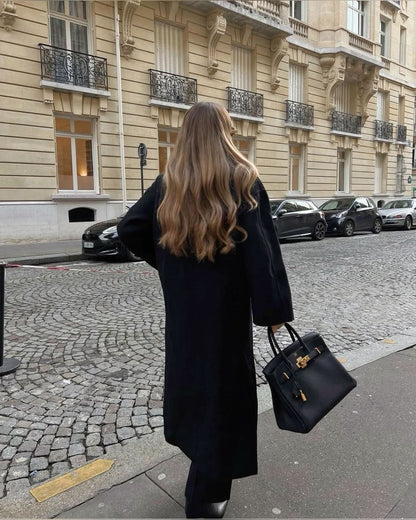 Black long coat with oversized silhouette and button front