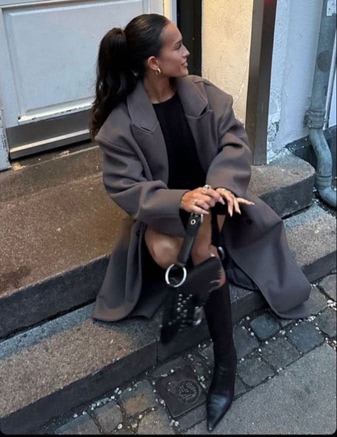 Charcoal gray long coat with relaxed shoulders and lapel detail