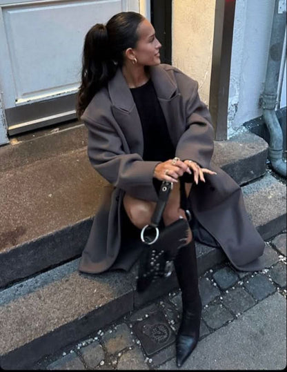 Charcoal gray long coat with relaxed shoulders and lapel detail