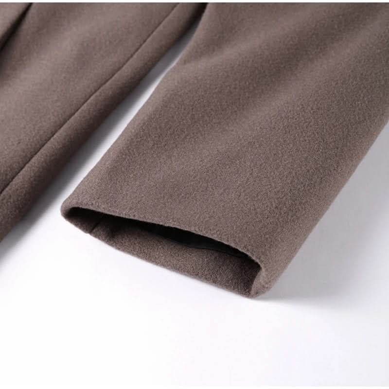 Taupe long coat hem and cuff showing quality fabric drape