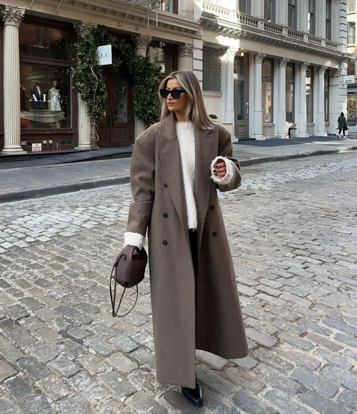 Taupe double-breasted long coat with notch lapels and button closure