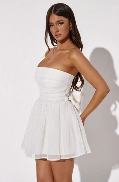 Side angle white strapless mini dress with gathered bodice