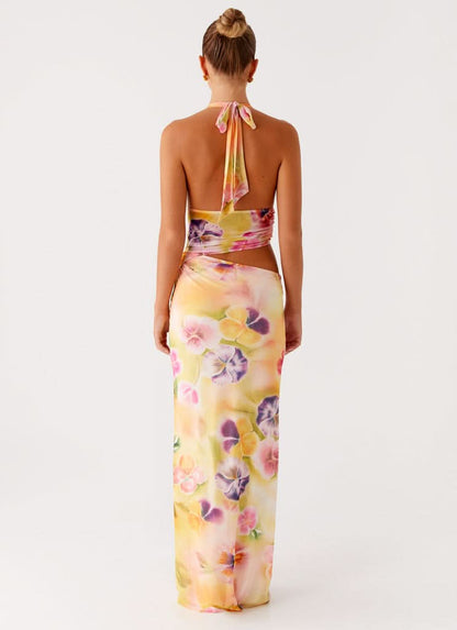 Back view of halter midi dress with tied neckline and wrapped waist detail