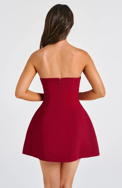 Blush pink strapless mini dress outdoor styling with structured fit