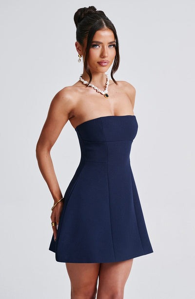 Burgundy strapless mini dress with structured bodice and pocket details