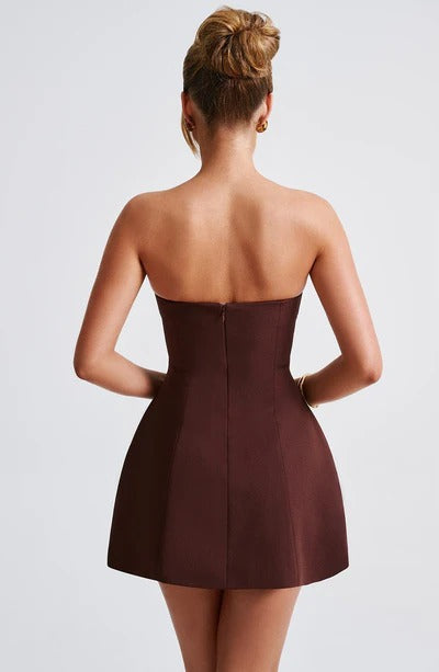Back view of burgundy strapless mini dress showing center seam and A-line cut