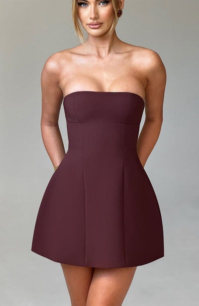 Back view of burgundy strapless mini dress showing center seam and A-line cut