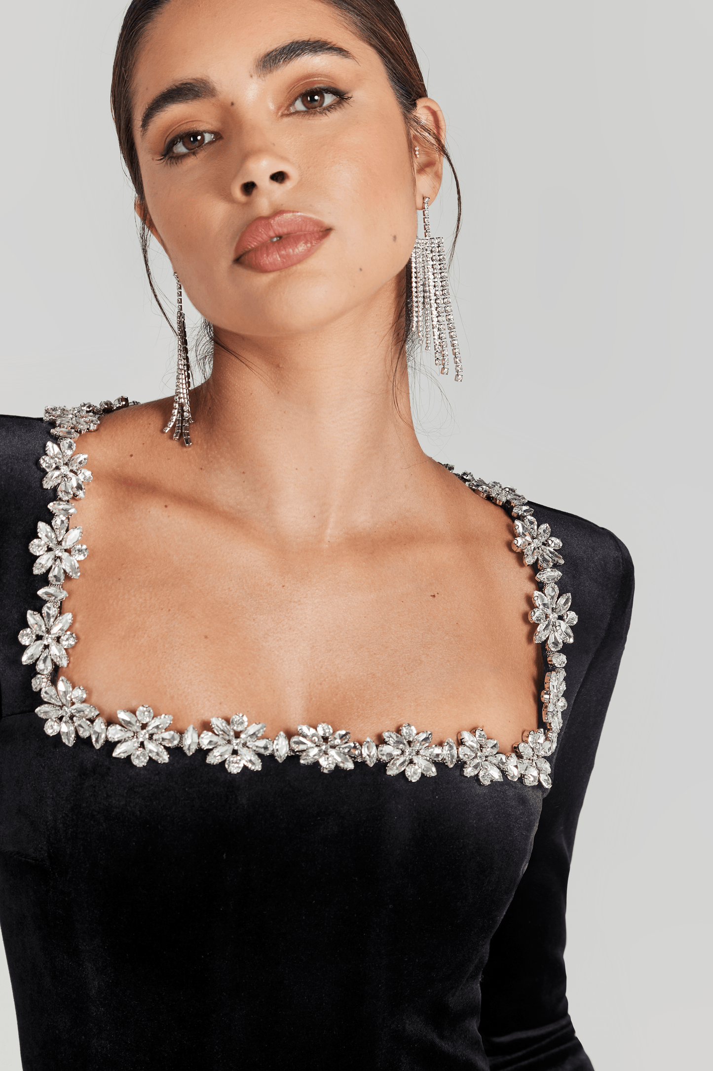 Black velvet jumpsuit shoulder and neckline with sparkling crystal embellishment