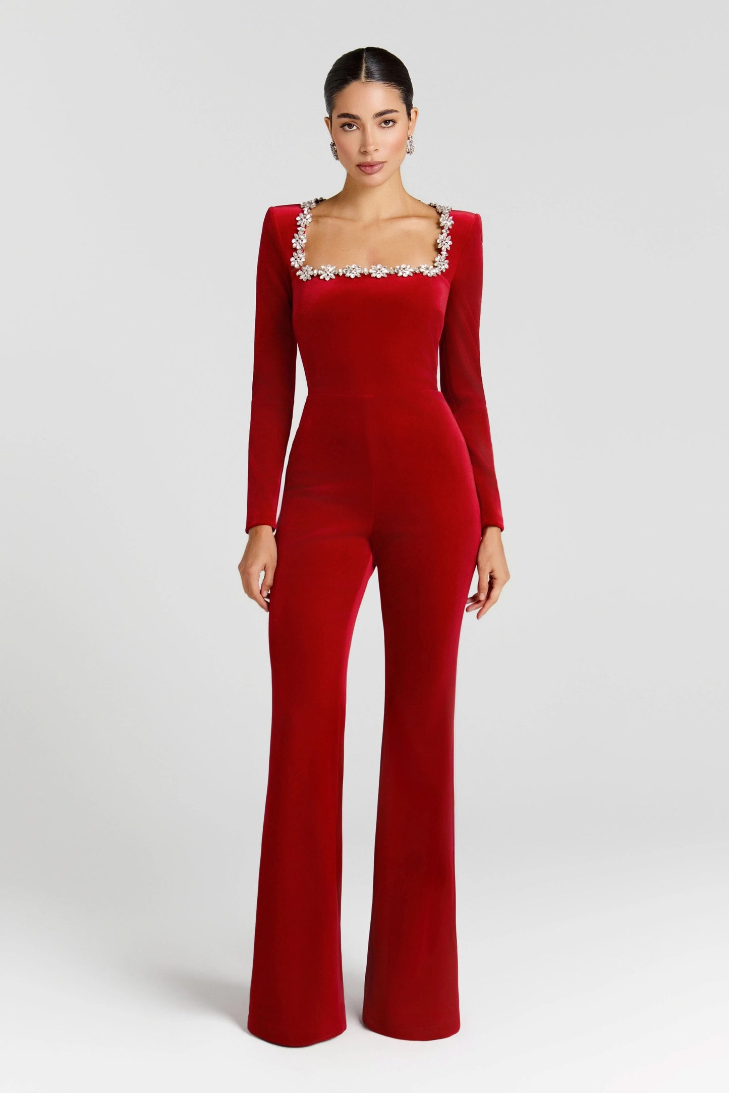 Red velvet jumpsuit with long sleeves and jeweled square neckline