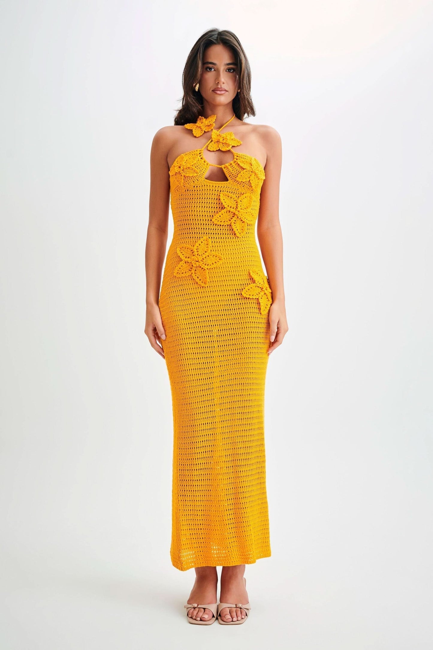 Golden yellow crochet maxi dress with halter neckline and decorative butterfly appliqués