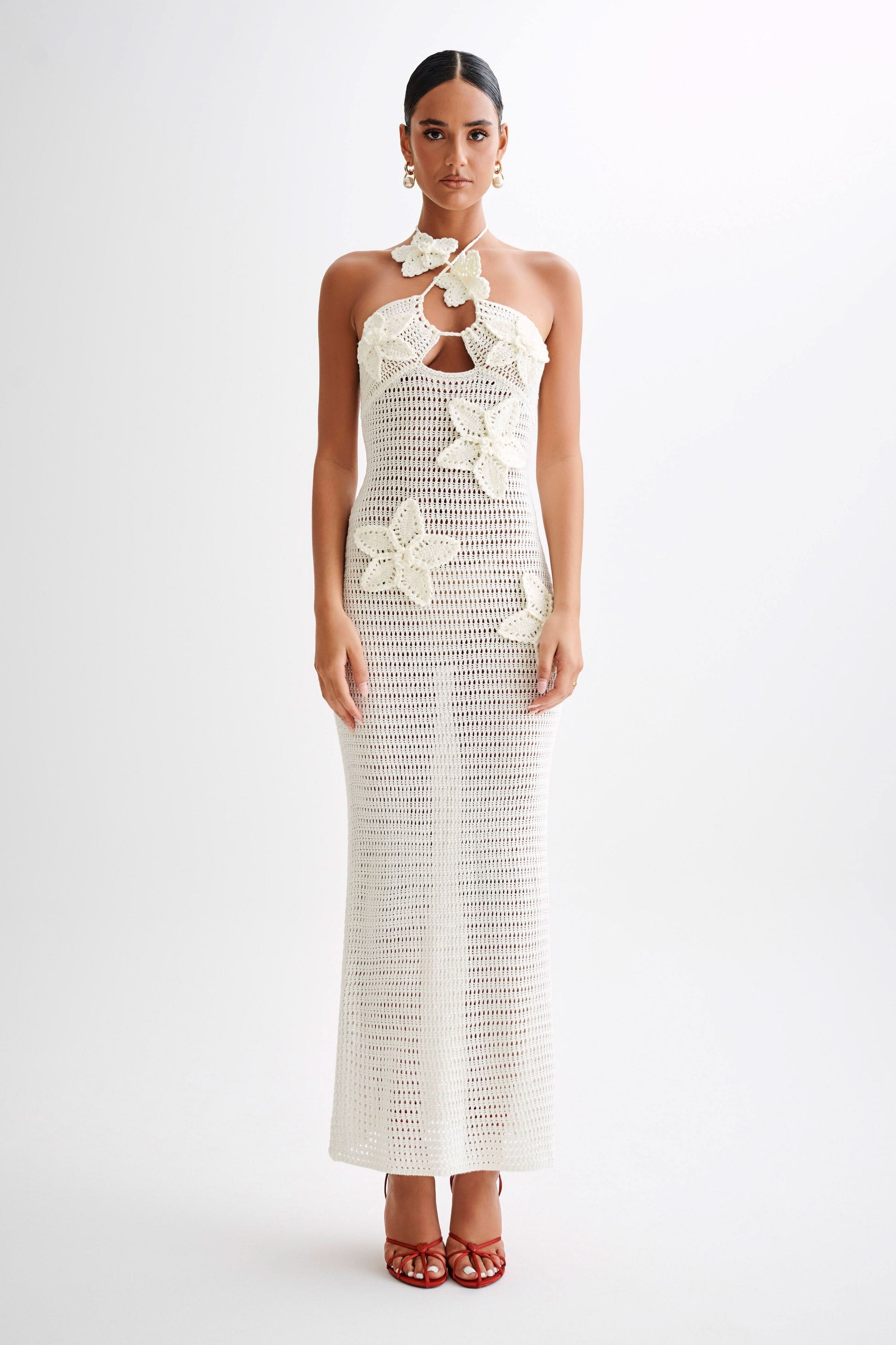 Cream crochet maxi dress with halter neck and delicate floral crochet details down the front