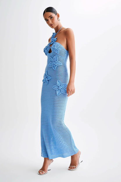 Blue crochet maxi dress with white flower appliqués and cutout front