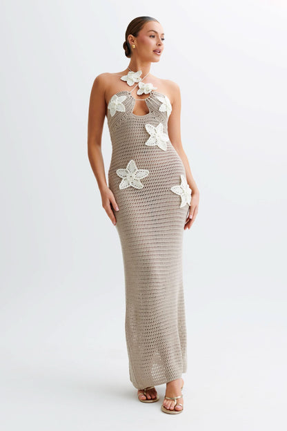 Beige crochet maxi dress with white flower appliqués and halter neckline