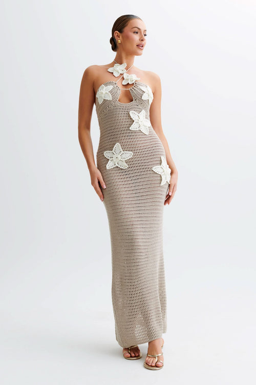 Beige crochet maxi dress with white flower appliqués and halter neckline