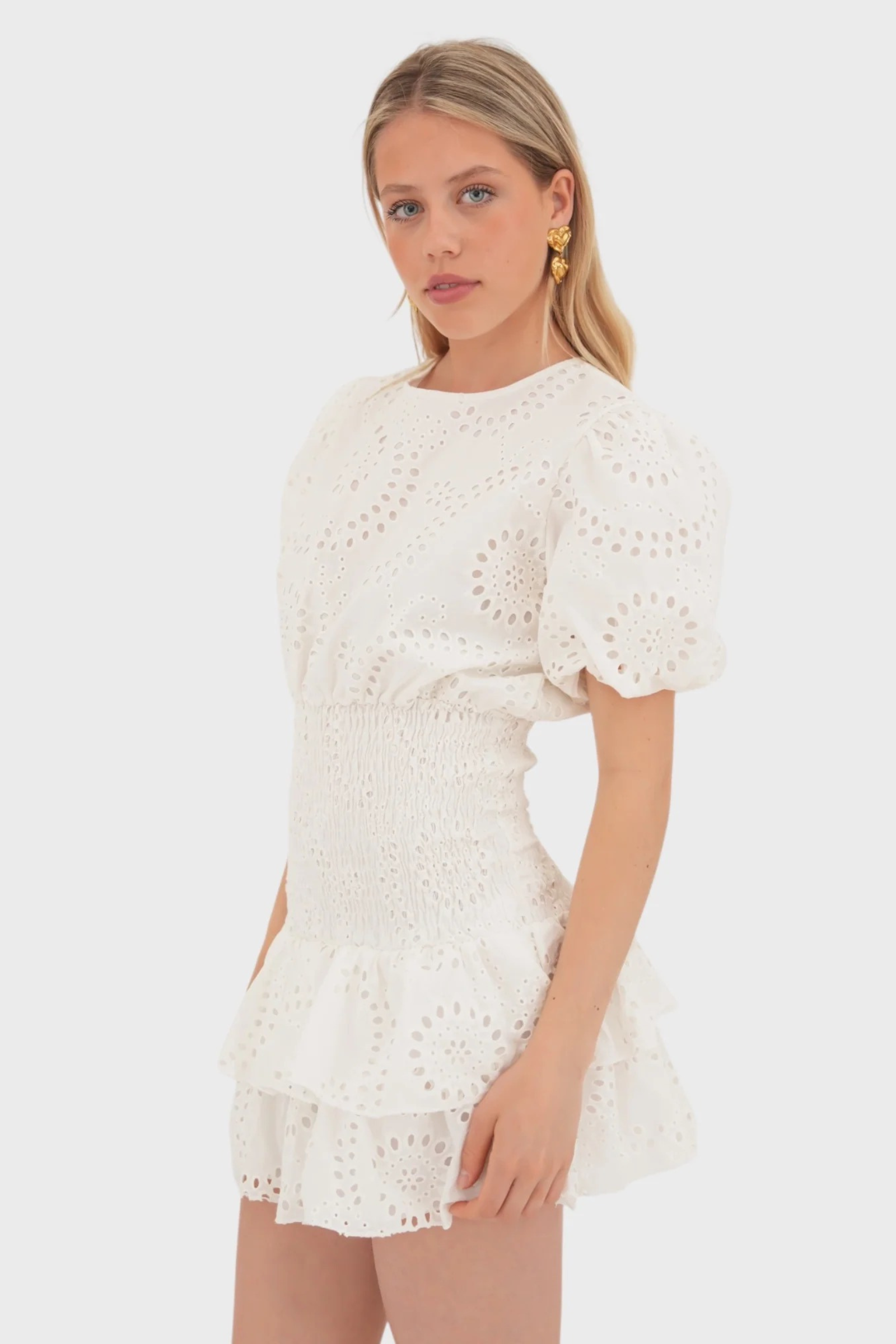 Cream eyelet mini dress with puffed sleeves and smocked waistband