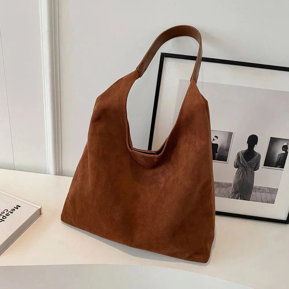 Cognac brown suede tote bag front view on white surface