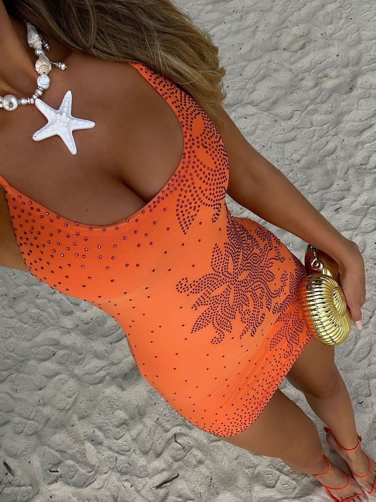 Orange rhinestone halter mini dress with geometric pattern detail