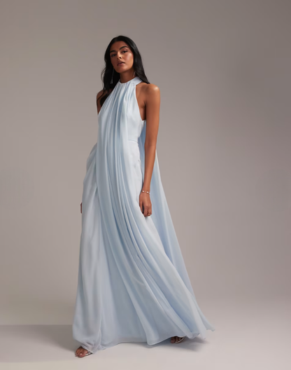 Blue maxi dress back view showing open cape-like chiffon draping detail