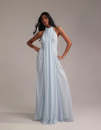 Front three-quarter view of blue chiffon maxi dress with fitted halter bodice