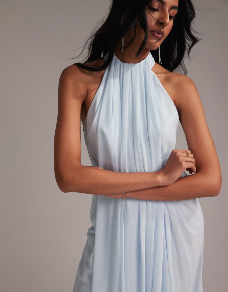 Close-up detail of pleated halter neckline on blue chiffon maxi dress