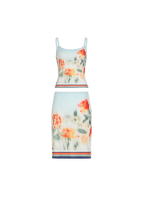 Flat lay of blue floral stretch mesh two-piece cami and midi skirt set