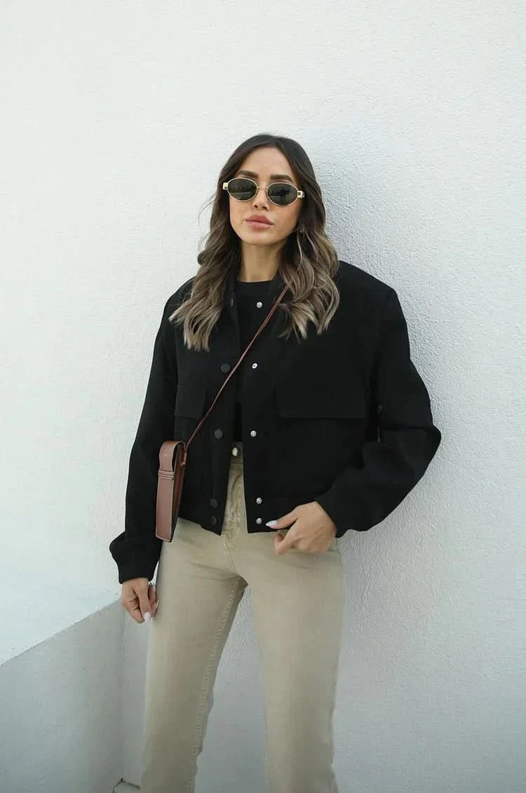 Black bomber jacket with patch pockets and button closure