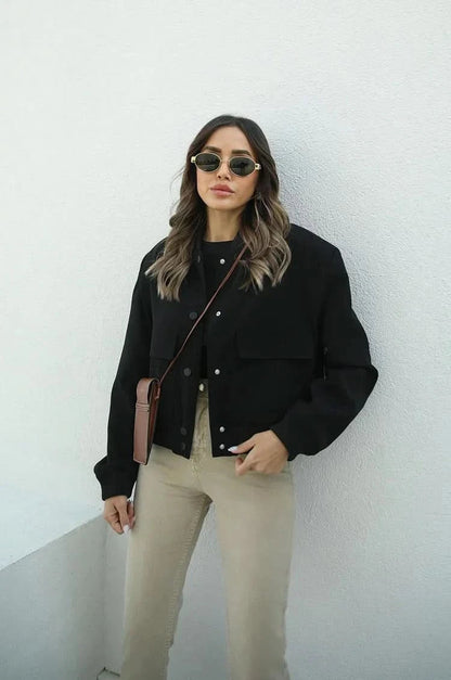 Black bomber jacket with patch pockets and button closure