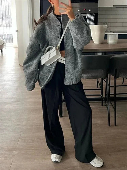 Gray heathered oversized bomber jacket styled with black wide-leg trousers