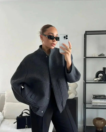 Charcoal gray oversized bomber jacket with relaxed fit and textured knit
