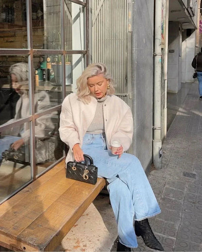 Cream beige oversized bomber jacket with relaxed silhouette and knit construction