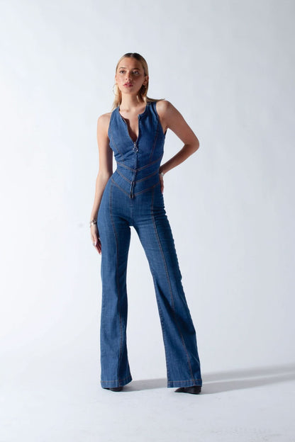 Full-length denim jumpsuit with flared legs and fitted waist on white background