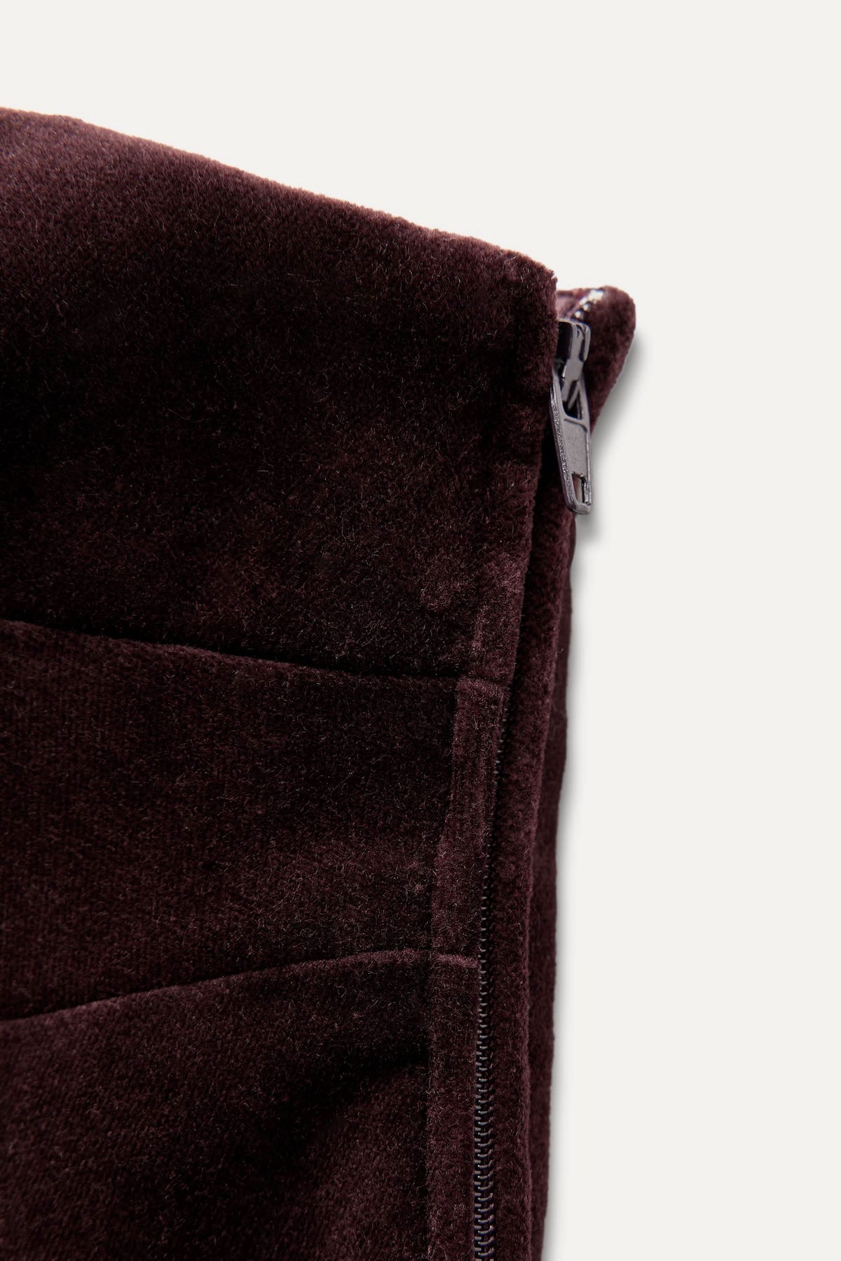 Burgundy velvet dress side seam and zipper detail
