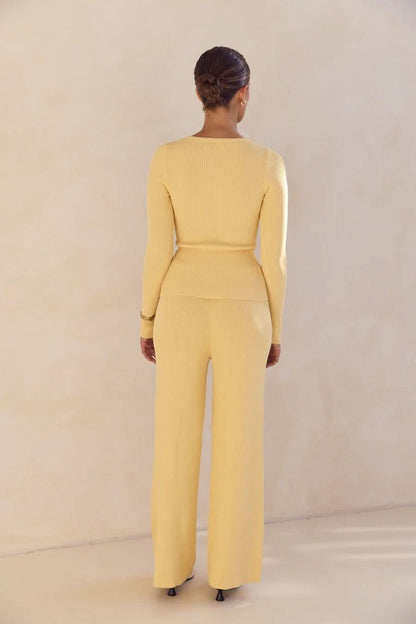Yellow ribbed knit set with long sleeves and wide-leg pants, back view