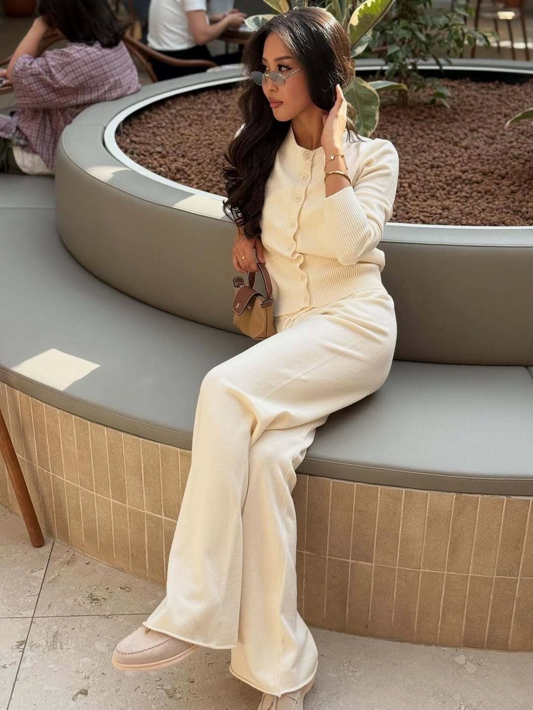 Cream knit set featuring button cardigan and wide-leg ribbed pants